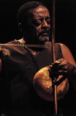 Naná Vasconcelos playing the Afro-Brazilian Berimbau