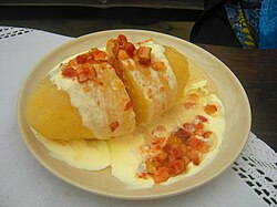 Cepelinai, a potato-based dumpling dish characteristic of Lithuanian cuisine with meat, curd or mushrooms