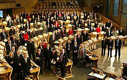 The 2003 election's 129 Members of the Scottish Parliament; 73 represented individual constituencies and 56 represented eight additional member regions