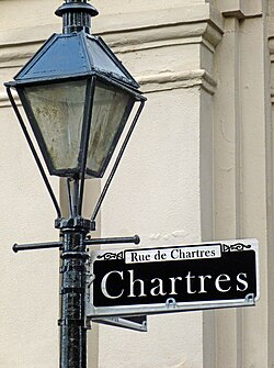 A streetlight and sign in the French Quarter section of New Orleans, LA