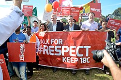 Burke in a 2014 protest against the Abbott government's proposed changes to section 18(c) of the Racial Discrimination Act