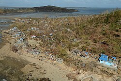 The island of Binuluanguan overflown by a helicopter from HMS Daring