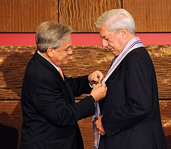 Vargas Llosa receiving the Gabriela Mistral Order of Educational and Cultural Merit from President Sebastián Piñera in 2010
