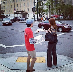 Handing out free copies of the New Orleans edition in the New Orleans Central Business District, October 2012