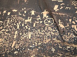 Newspaper Rock State Historic Monument, Utah, contains petroglyphs left by the first inhabitants of the American Southwest.