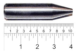 Shiny metallic cylinder with a sharpened tip. The overall length is 9 cm and diameter about 2 cm.