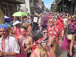 Decadence participants parading down Royal Street