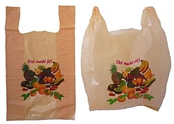 A German plastic shopping bag, freshly folded (left) and used (right)