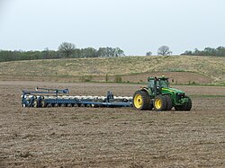 A John Deere 8530 tractor with a Kinze 3700 planter