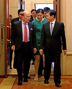 Zhong (right) with US Commerce Secretary Wilbur Ross (left)