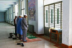 Hui people praying in the Dongguan Mosque, Xining