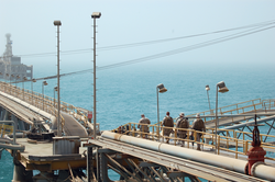 US Navy and Coast Guard personnel stand guard aboard the Al Basrah Oil Terminal in July 2009