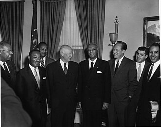 Eisenhower meets with civil rights leaders in the Oval Office, June 23, 1958Left to right: Lester Granger, Martin Luther King Jr., E. Frederic Morrow, Eisenhower, A. Philip Randolph, William P. Rogers, Rocco Siciliano, and Roy Wilkins.