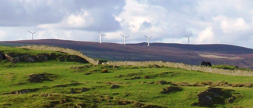 Wind turbines such as these, in Cumbria, England, have been opposed for a number of reasons, including aesthetics, by some sectors of the population.[159][160]