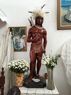 A statue inside a Candomblé terreiro in São Paulo; it depicts a Native American spirit, a caboclo