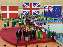 A medal ceremony at the 2008 Summer Olympics with (from left to right): the Danish flag, the Union Flag of the UK, and the New Zealand flag