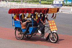 A cycle rickshaw at Xiyuan, Beijing, targeting at tourists from Summer Palace