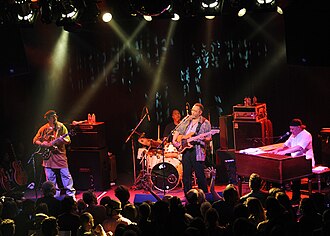 The rhythm section of a funk band—the electric bass, drums, electric guitar and keyboards—is the heartbeat of the funk sound. Pictured here are the Meters.