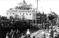 Jewish State ship, one of several Haganah ships that carried Jewish immigrants from Europe, mostly illegal, at the Haifa Port, Mandatory Palestine, 1947[70]