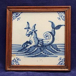 17th century Delft blue and white tile with sea monster