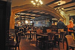 The Yankee Doodle Tap Room inside the inn, with a Norman Rockwell mural behind the bar