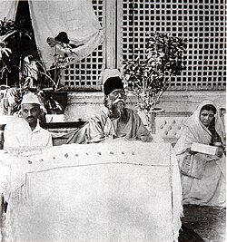 Gandhi (wearing a Gandhi cap) with Rabindranath Tagore and Sharda Mehta, 1920