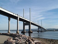 The Kessock Bridge, completed in 1982, which crosses the Moray Firth and shortened the route north out of Inverness by 14 miles (23 km)