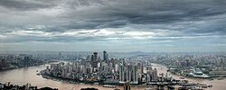 The confluence of the Jialing and the Yangtze in Chongqing. The Yangtze flows left to right across the bottom of the image.