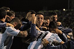 Scaloni, as an assistant coach, embracing the team after Argentina qualified for the 2018 FIFA World Cup.