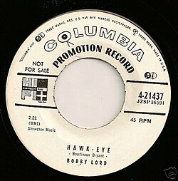 Transitional 1955 promo 45 r.p.m. label showing both the old notes and mike and new walking eye logos