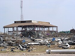 US Navy 050902-N-0000X-017 A U.S. Navy Seabee uses a traxcavator to remove debris from Hurricane Katrina on board Naval Construction Battalion Center (NCBC) Gulfport, Miss