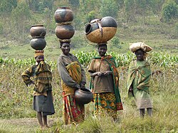 Batwa women with traditional pottery