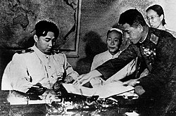 Kim signs the Korean Armistice Agreement.