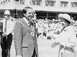 The Queen with the Brian Elwood, Mayor of Palmerston North, New Zealand, during a walkabout in The Square, 26 February 1977