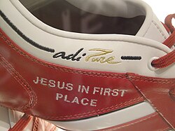 A pair of Kaká's Adidas boots, with a declaration of his Christian faith. In his goal celebrations Kaká invariably points towards the skies to express gratitude to God.[249]