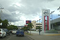 Nissan car dealership on Central America Blvd, across the street from Plaza Miraflores Mall