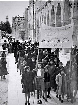 A 1930 protest in Jerusalem against the British Mandate by Arab women. The sign reads "No dialogue, no negotiations until termination of the Mandate."
