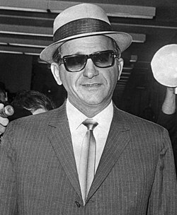 Sam Giancana (pictured), Santo Trafficante, and others, who were recruited by the CIA to assassinate Fidel Castro in Cuba[123]