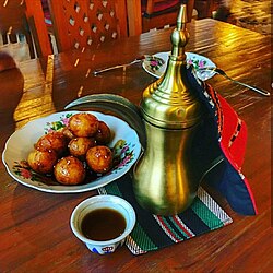 Arabic coffee with lugaimat, a traditional Emirati sweet