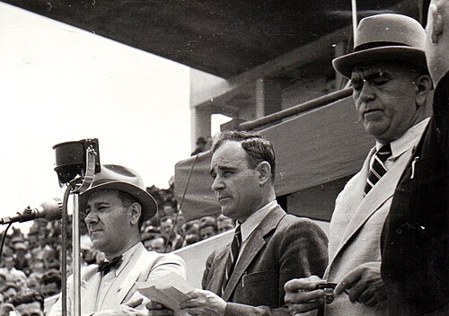 Ralea (left) and Petru Groza, flanking Gheorghe Gheorghiu-Dej as he addresses the Ploughmen's Front Congress, June 1945
