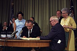 Former president Truman and wife Bess at Johnson's signing of the Medicare Bill in 1965, as Lady Bird and Hubert Humphrey look on