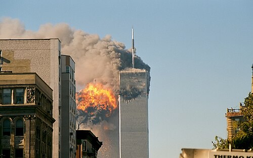 United Airlines Flight 175 crashes into 2 World Trade Center, while 1 World Trade Center burns from the prior crash of American Airlines Flight 11