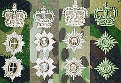 The rank insignia for officers are also differentiated by what specific stars are used.Left to right: Grenadier, Coldstream, and Welsh Guards (Garter); Scots Guards (Thistle); Irish Guards (Shamrock); other army officers (Bath).