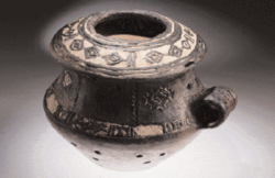The Vučedol culture pottery, from this era, dating back 5,000 years, is characterized by its dark, polished surface, white-filled geometric incisions, and sophisticated, often zoomorphic, shapes.