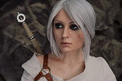 A model cosplaying Ciri, a main character of The Witcher 3: Wild Hunt