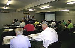 Wool buyers' room at a wool auction, Newcastle, New South Wales