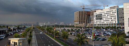 The Mall of Asia concert grounds (bottom center), pictured in 2011, are used as a parking lot when an event is not being held within the grounds.