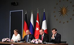 Angela Merkel, Vladimir Putin, Recep Tayyip Erdoğan and Emmanuel Macron giving a press conference as part of Syria summit in Istanbul, Turkey