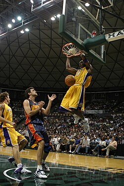 Bryant dunking against the Golden State Warriors during a preseason game in Honolulu, Hawaii, in October 2005