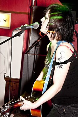 Louise Distras, advocate of crowdfunding, performing